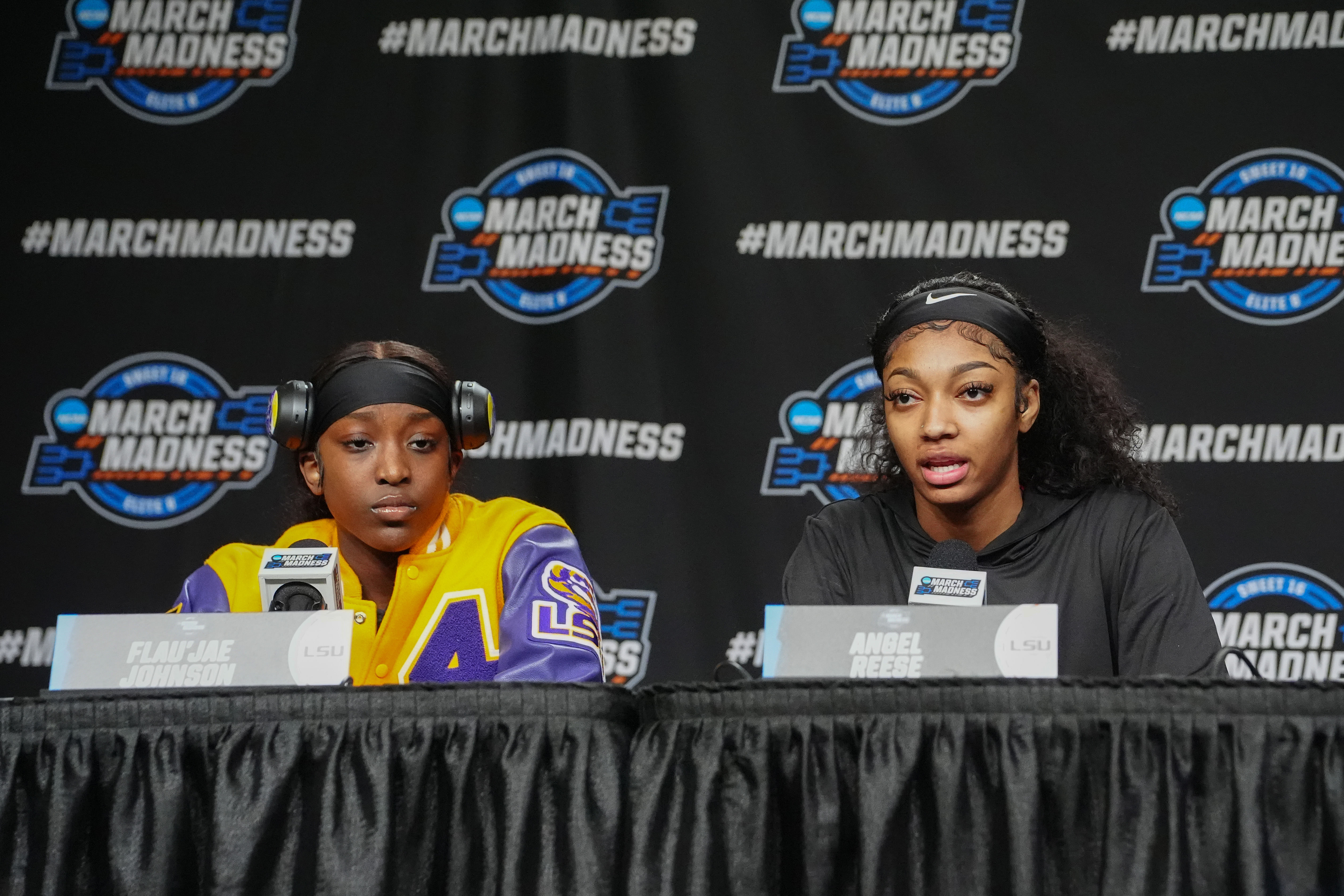 LSU Tigers guard Flau'jae Johnson (#4) and forward Angel Reese (#10) answer questions during the press conference to their NCAA Tournament Sweet 16 game at MVP Arena. Photo: Imagn